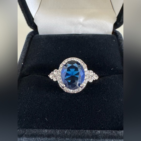 Elegant Sapphire Blue Oval Crystal Halo Ring Silver Tone Costume Jewelry Size 6 - Picture 1 of 6